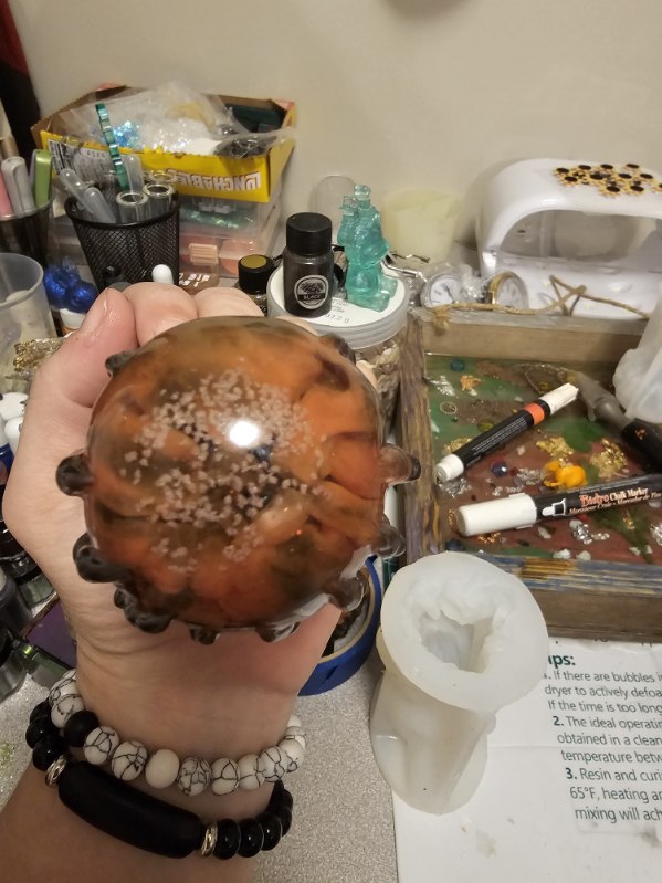 demon crystal ball hands figure